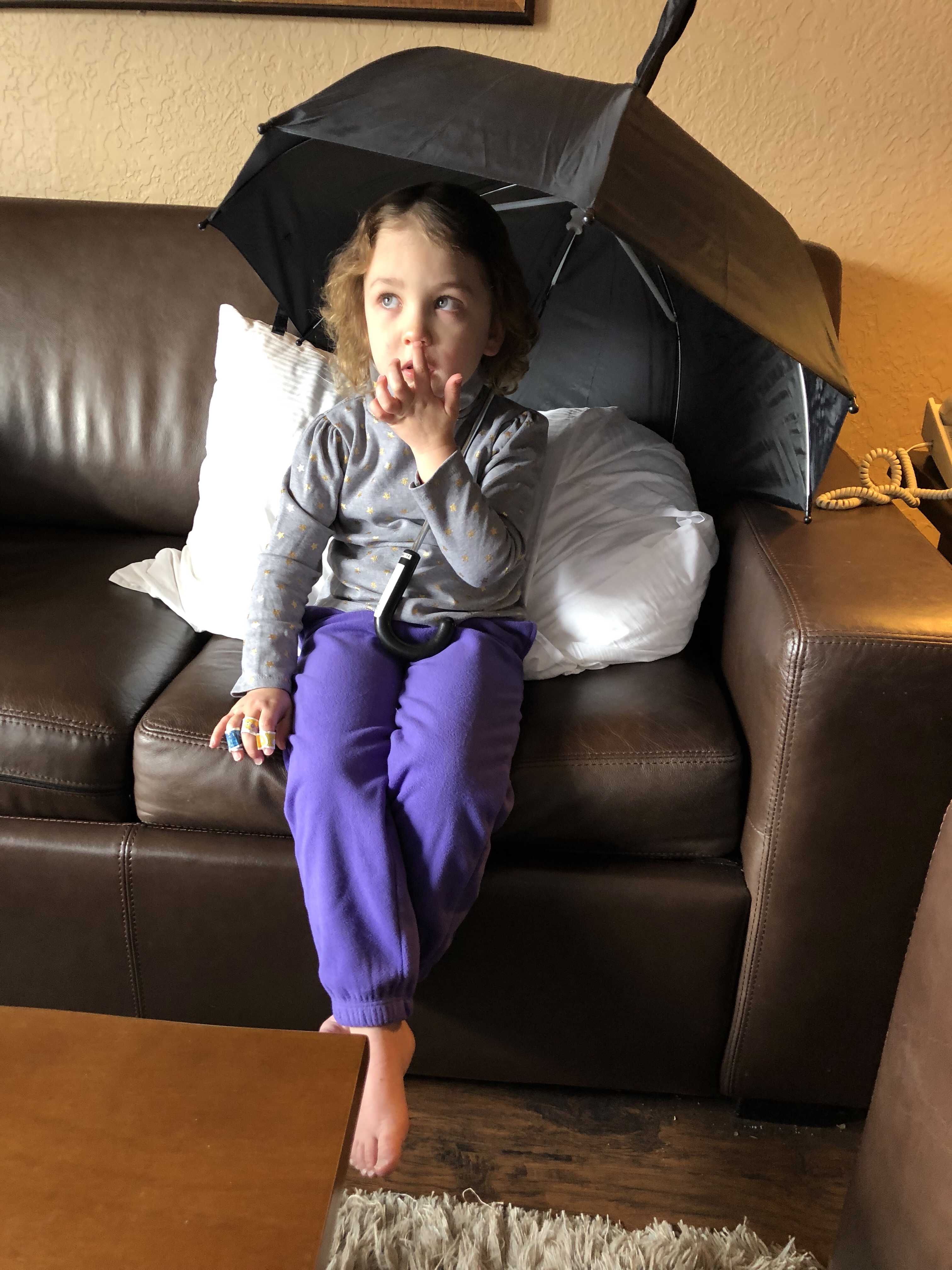 She’s definitely thinking about picking her nose.